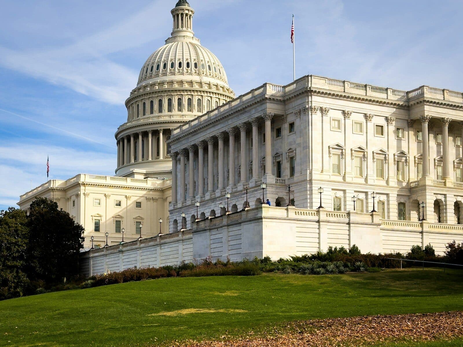a large white building with a flag on top of it